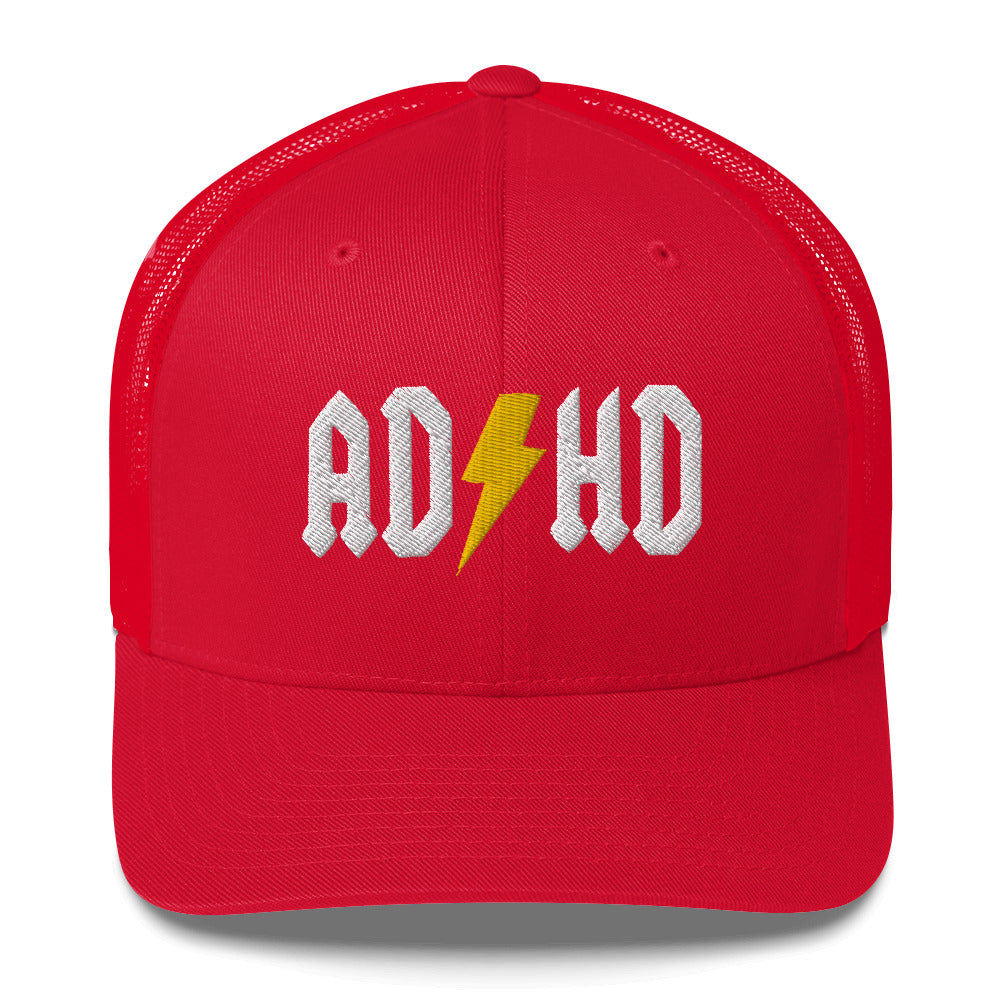 Meemirottan ADHD Lippis on punainen pesäpallolippis, jossa on mesh-takaosa, jonka edessä on teksti "ADHD". Kirjaimet ovat valkoisia, ja keltainen salama korvaa "H"-kirjaimen, joten se on yksi niistä hauskoista maksuista, jotka sopivat leikkisään tyyliin.