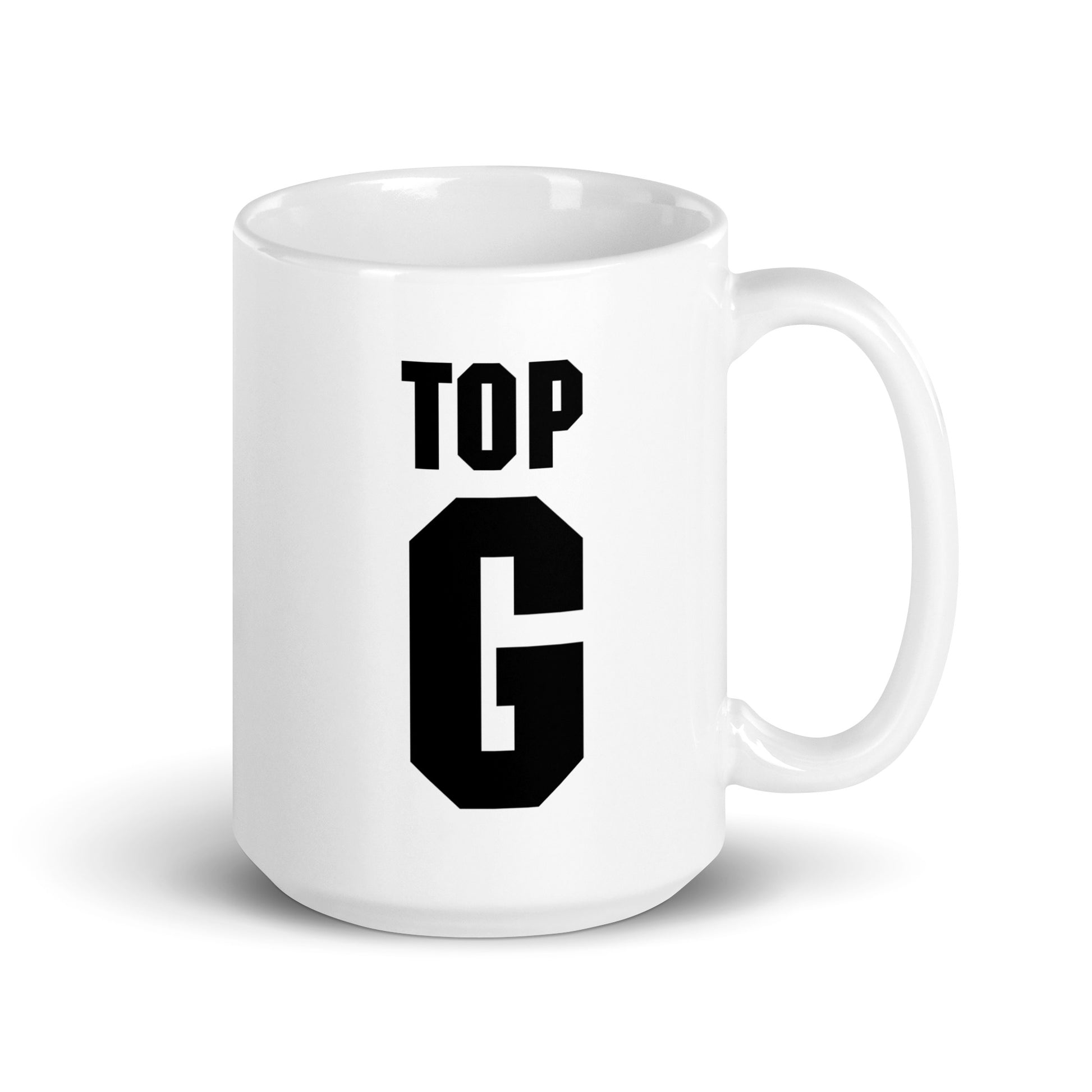 Valkea top g muki mustalla tekstillä, jossa lukee TOP G, moderni ja tyylikäs design.